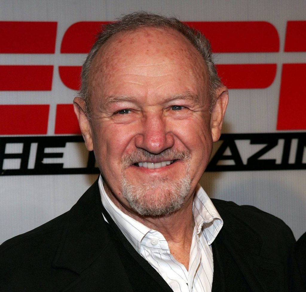 Gene Hackman smiling in dark jacket and striped shirt ESPN The Magazine portrait wallpaper background