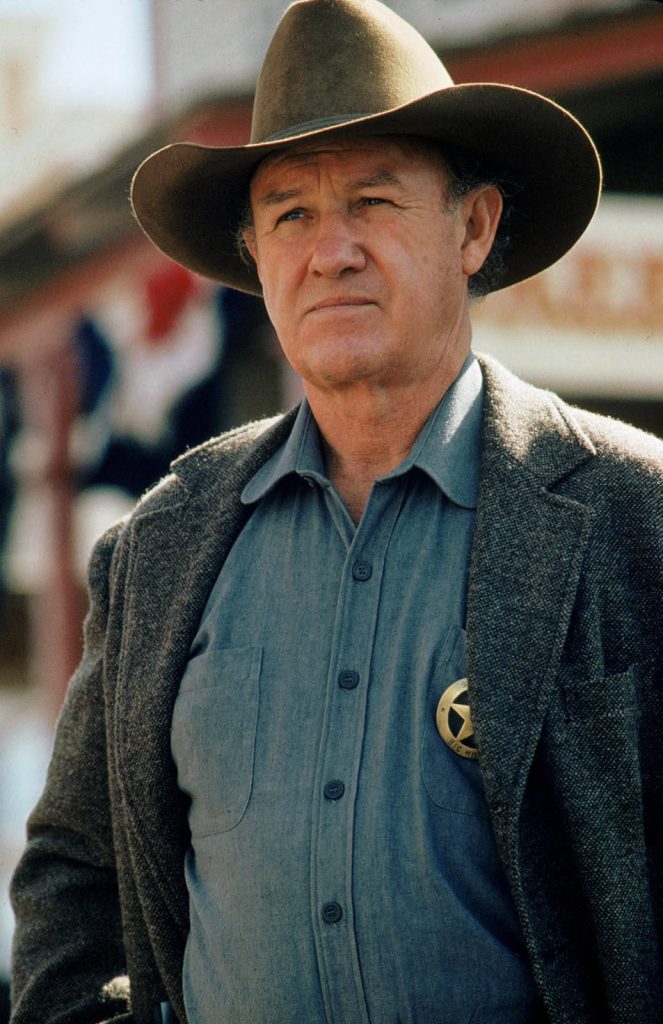 Gene Hackman as sheriff in Unforgiven wearing cowboy hat and badge cinematic portrait wallpaper