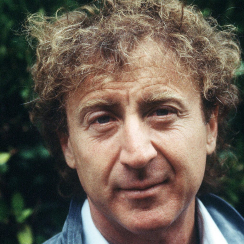 Gene Wilder close-up portrait with curly hair and gentle expression green natural background wallpaper