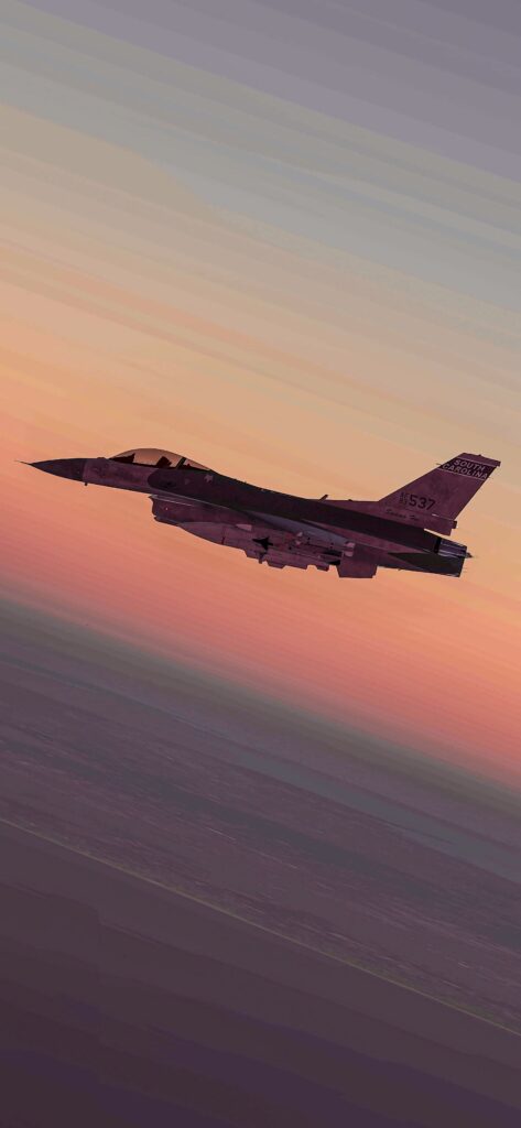 General Dynamics F-16 Fighting Falcon jet soaring at sunset with vibrant orange pink and purple sky Wallpaper