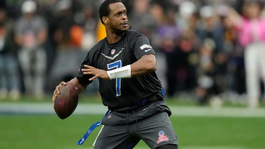 Seattle Seahawks quarterback Geno Smith in black uniform preparing pass NFL Pro Bowl action shot Wallpaper