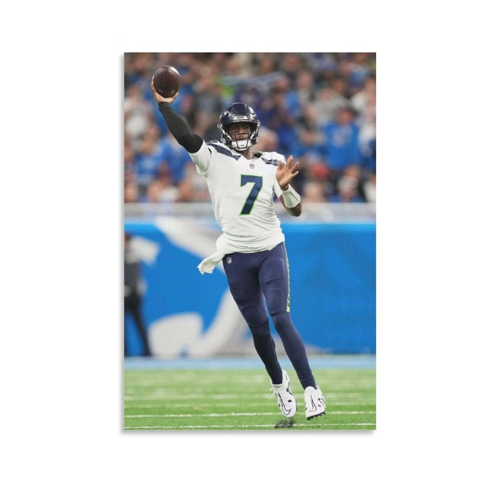 Seattle Seahawks Geno Smith mid-throw in white jersey NFL football action wallpaper background