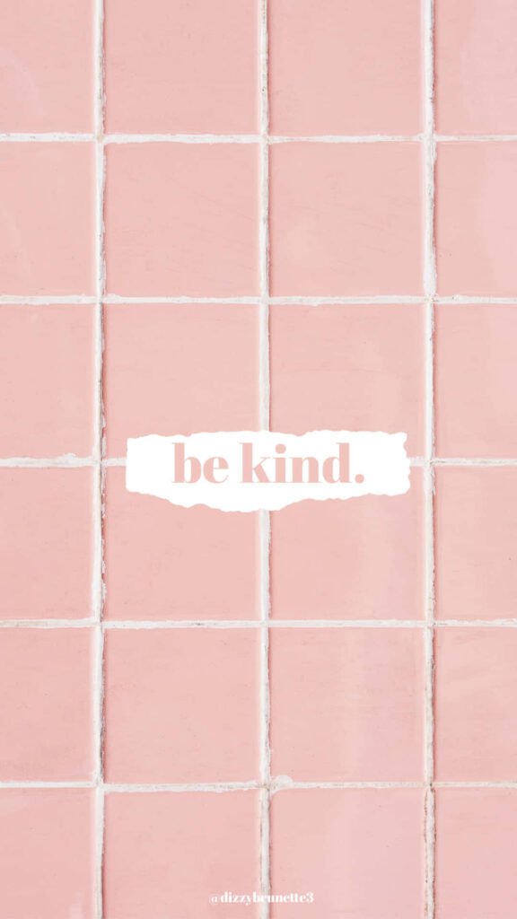 Pink tile grid wallpaper with white Be Kind message uplifting positive background design