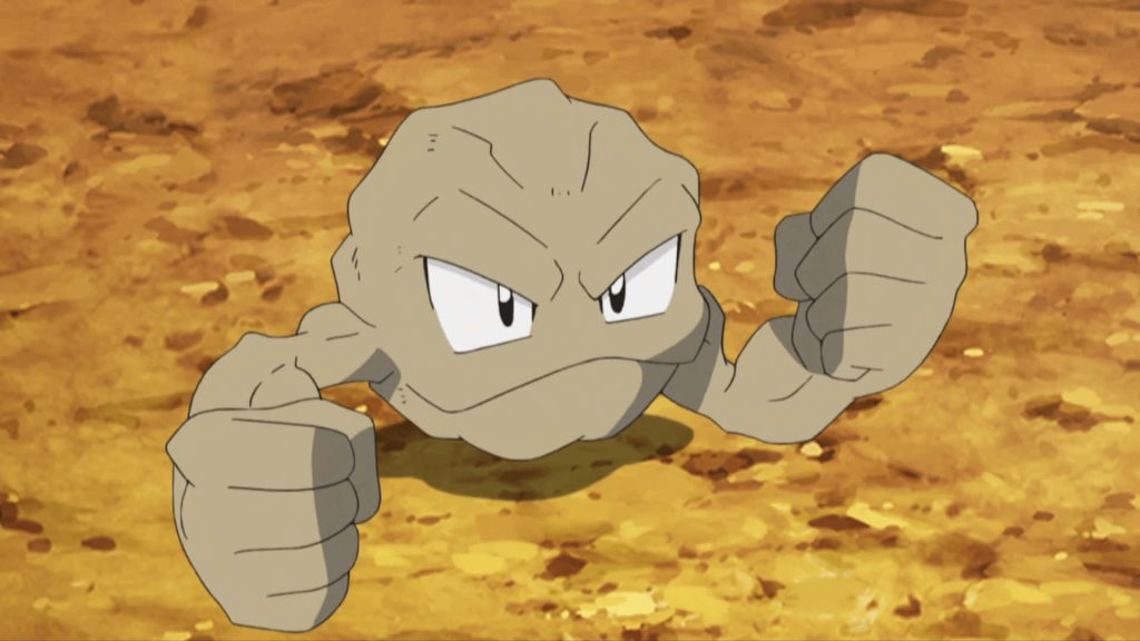 Anime-style Geodude wallpaper with intense expression and sandy rugged Rock-type background