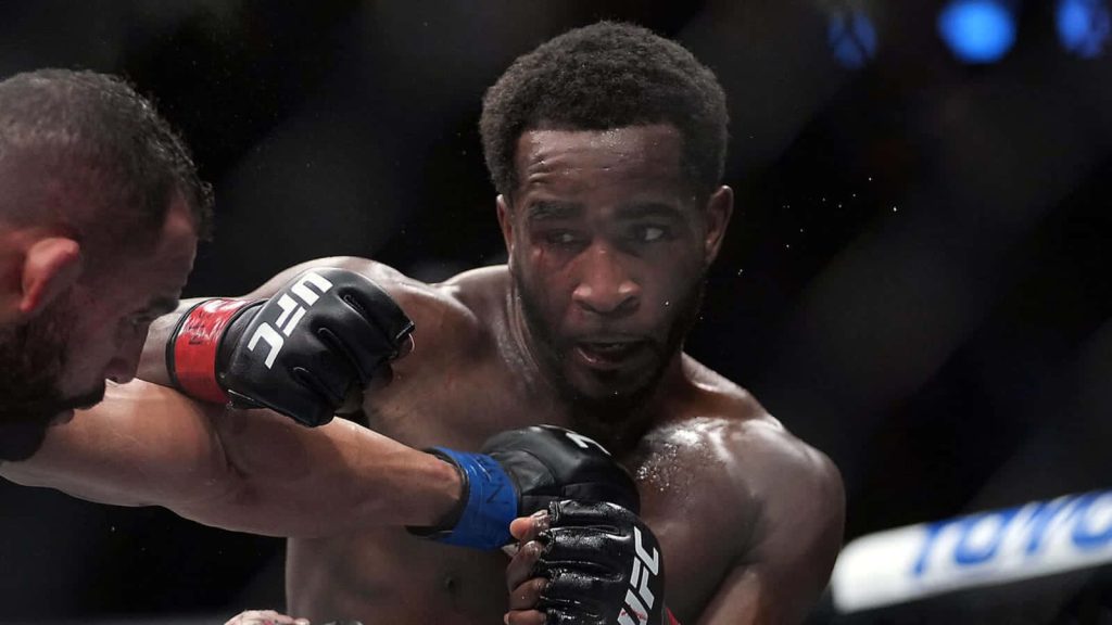 UFC welterweight Geoff Neal intense mid-match action high-contrast MMA fight wallpaper background