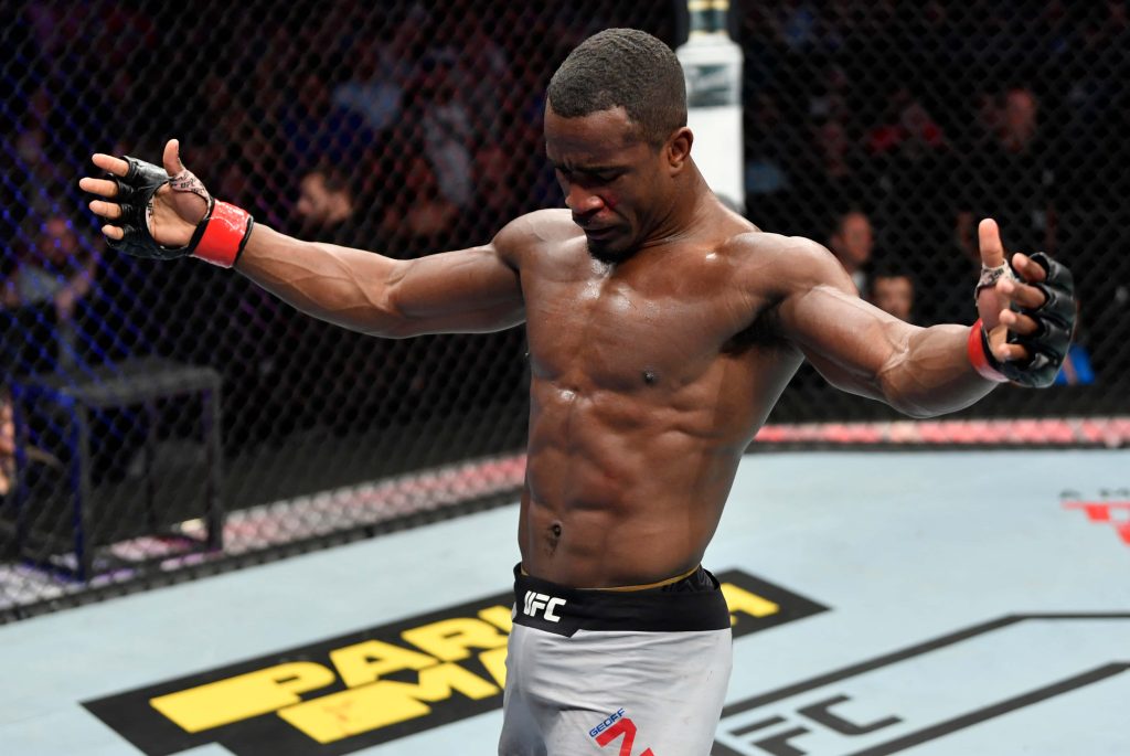 Geoff Neal UFC fighter in Octagon intense combat sports action MMA wallpaper background