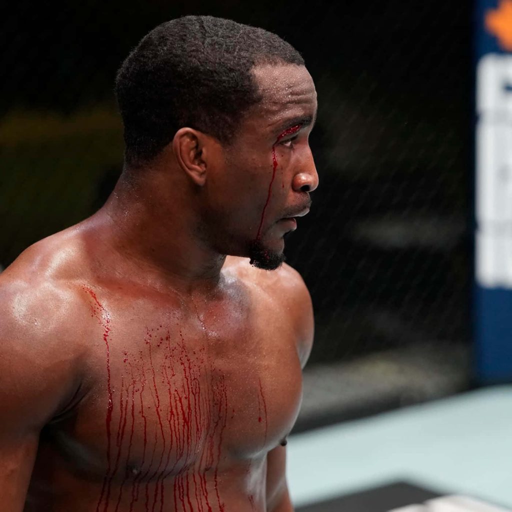 Geoff Neal UFC fighter bloodied intense MMA octagon fight high contrast sports wallpaper