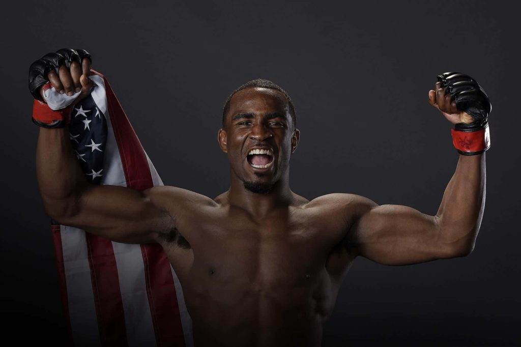UFC welterweight Geoff Neal celebrates with American flag showing muscular build and MMA gloves Wallpaper