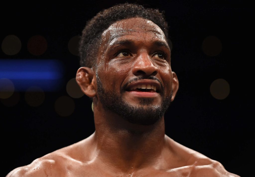 UFC welterweight fighter Geoff Neal intense close-up portrait sweat dramatic dark arena background Wallpaper