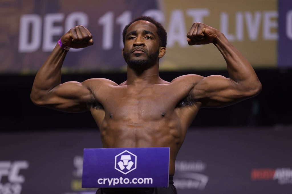Geoff Neal UFC welterweight flexing shirtless at official weigh in with crypto.com sign background Wallpaper