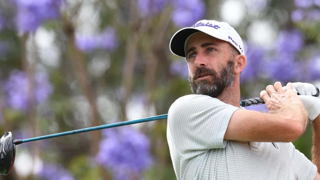 Geoff Ogilvy golf swing close-up white Titleist cap vibrant purple flowers scenic wallpaper