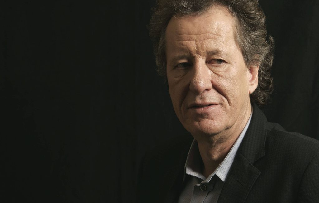 Portrait of Geoffrey Rush with dramatic side lighting black background film actor wallpaper