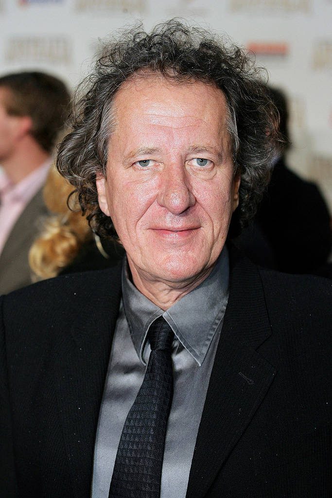 Geoffrey Rush in black suit high-resolution portrait wallpaper elegant actor background