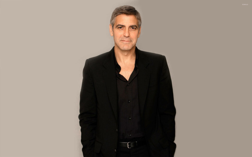 George Clooney in classic black suit and open collar shirt on gray background wallpaper