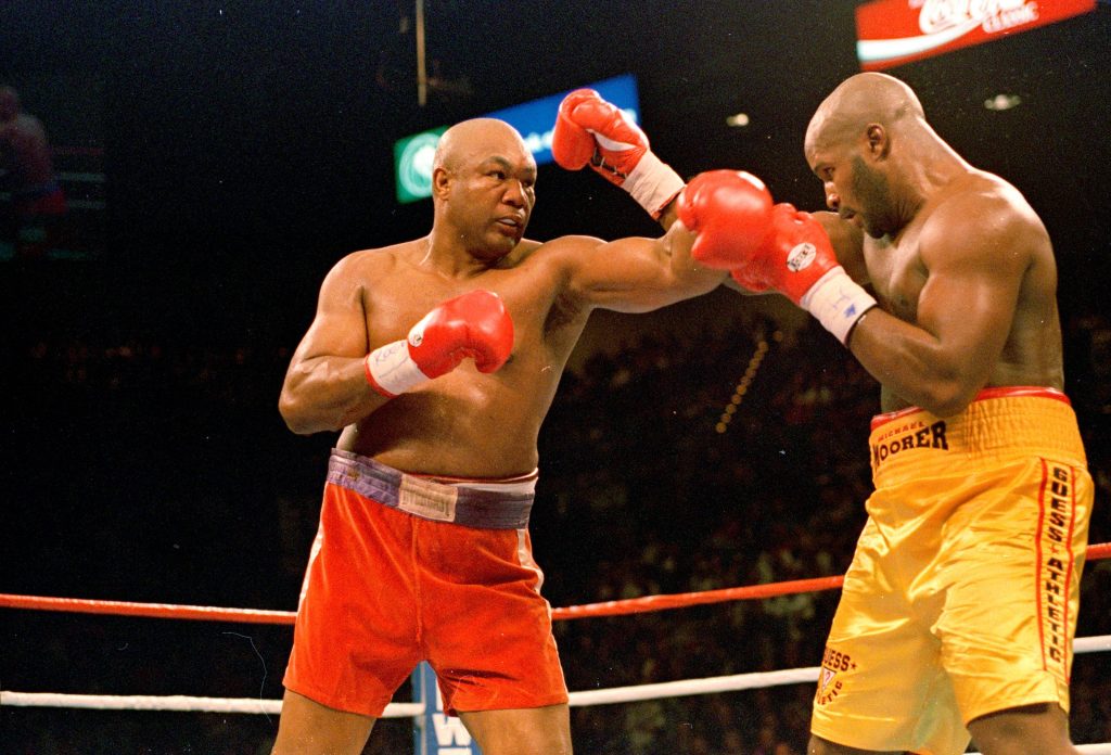 George Foreman vs Michael Moorer 1994 heavyweight boxing match intense fight wallpaper