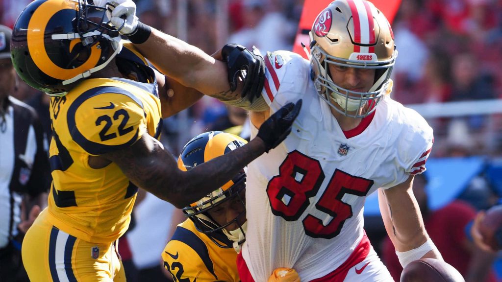 George Kittle #85 San Francisco 49ers battles Los Angeles Rams defender NFL football action wallpaper