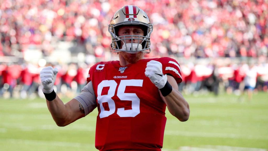 George Kittle in red 49ers jersey #85 helmet high action NFL football wallpaper background