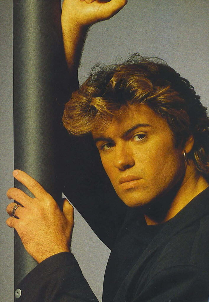 George Michael Iconic Style Wallpaper: Striking Pose Background
