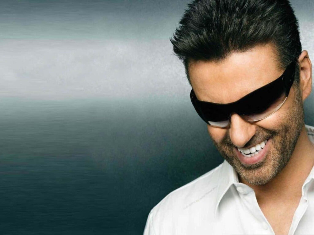 George Michael Confident Smile Wallpaper: Stylish Sunglasses & White Shirt
