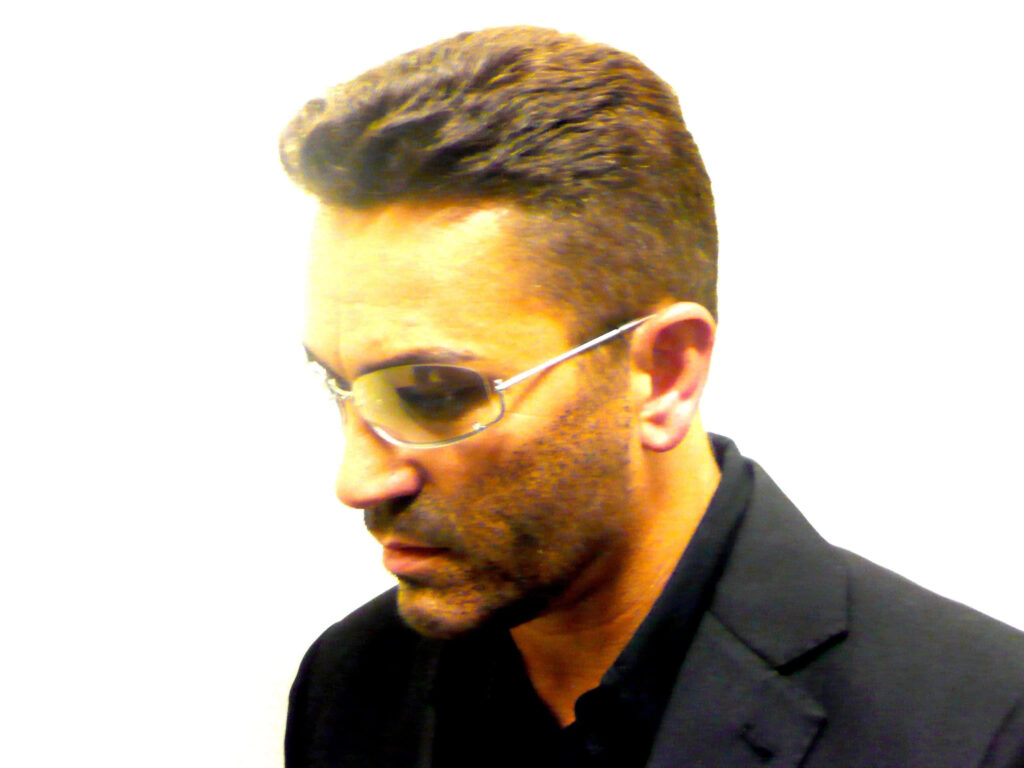 George Michael Iconic Look Wallpaper: Stylish Sunglasses & Black Suit