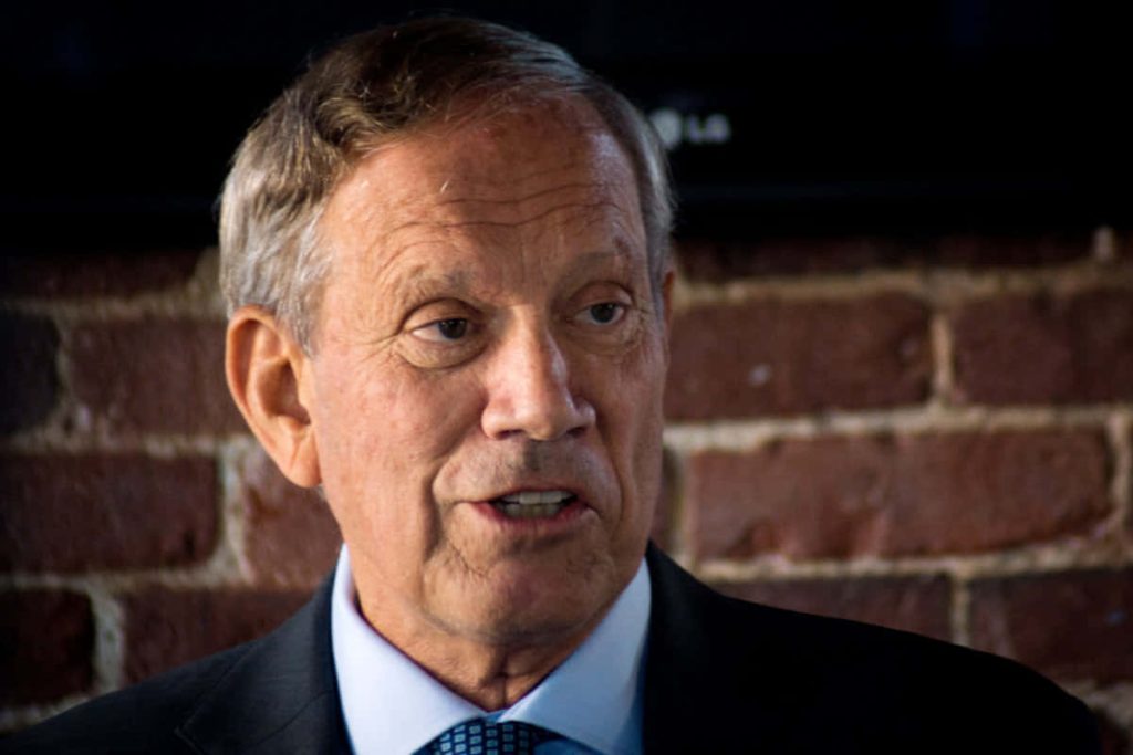 Former New York Governor George Pataki speaking in suit with rustic red brick background professional portrait Wallpaper