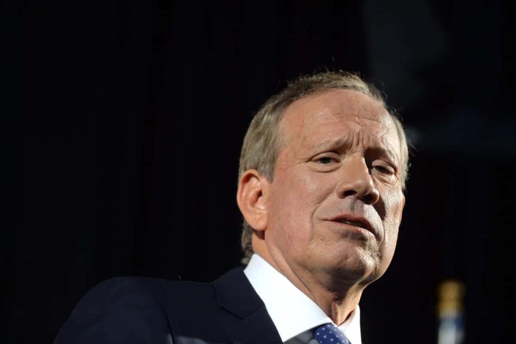 Portrait of former New York Governor George Pataki in dark suit with serious expression on black background Wallpaper
