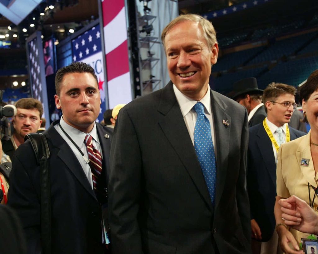 George Pataki smiling at Republican National Convention patriotic event with American flags Wallpaper