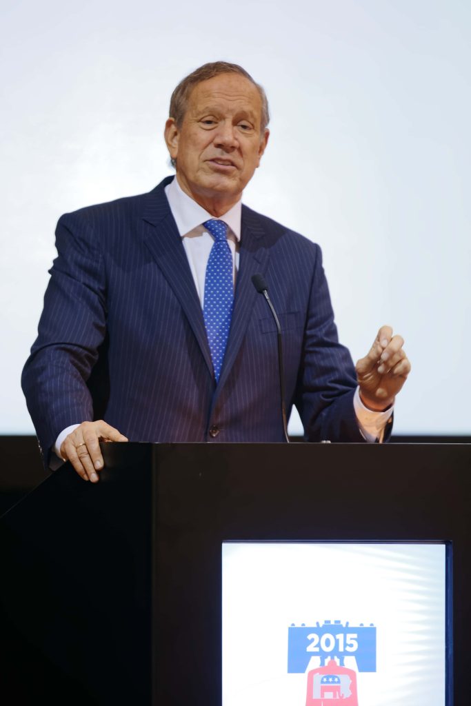 Former NY Governor George Pataki speaking at podium in navy pinstriped suit 2015 event Wallpaper