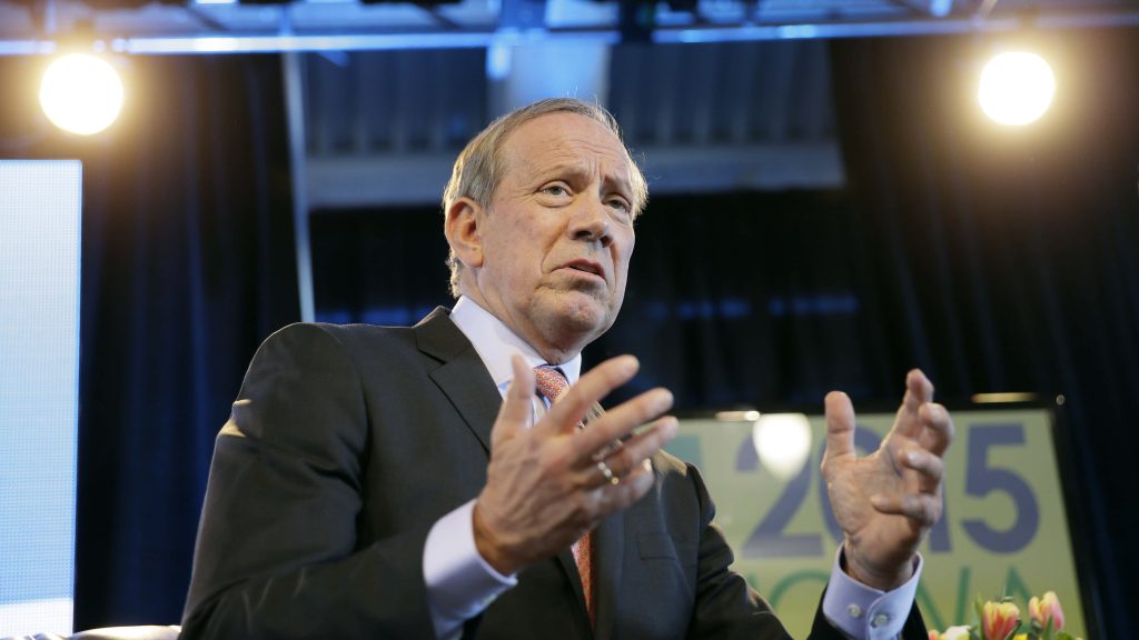 George Pataki speaking on stage in formal suit 2015 political wallpaper background