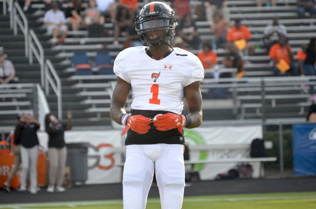 Football player George Pickens in white number 1 Hoover jersey action stadium wallpaper background