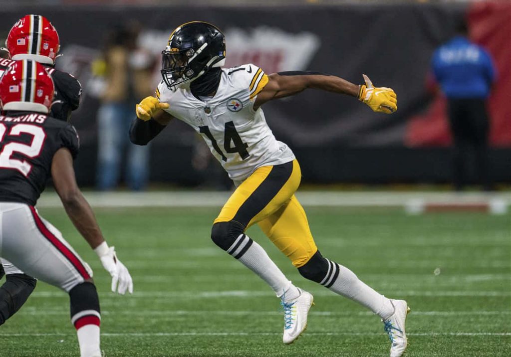 Pittsburgh Steelers wide receiver George Pickens sprinting in yellow gloves NFL action wallpaper