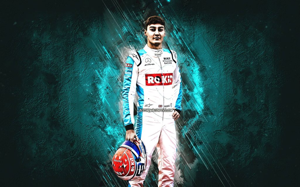 Formula 1 driver George Russell in ROKiT Williams suit with cyan energy streaks background Wallpaper