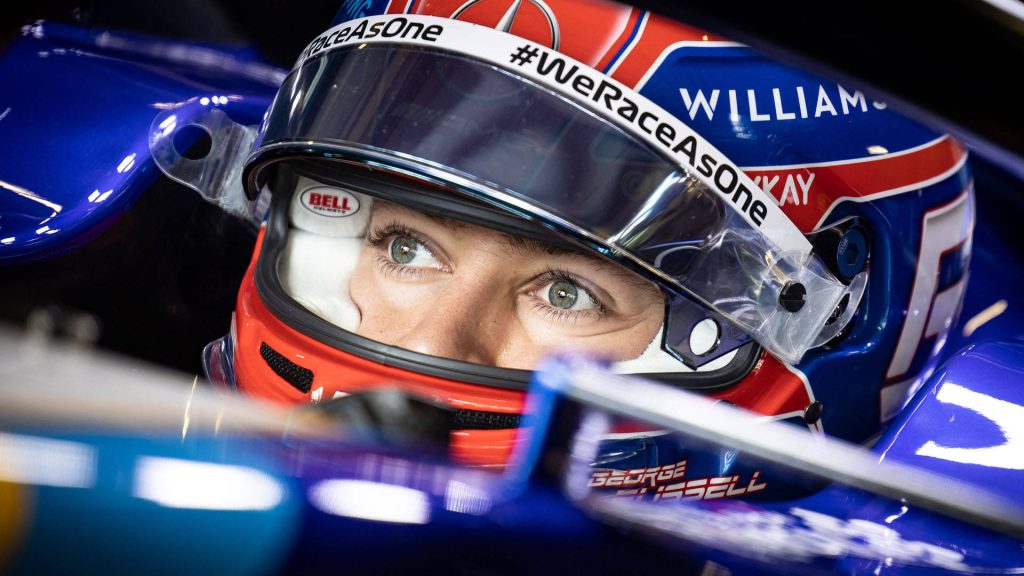 Close-up of George Russell in Williams Racing F1 cockpit with WeRaceAsOne blue white livery Wallpaper
