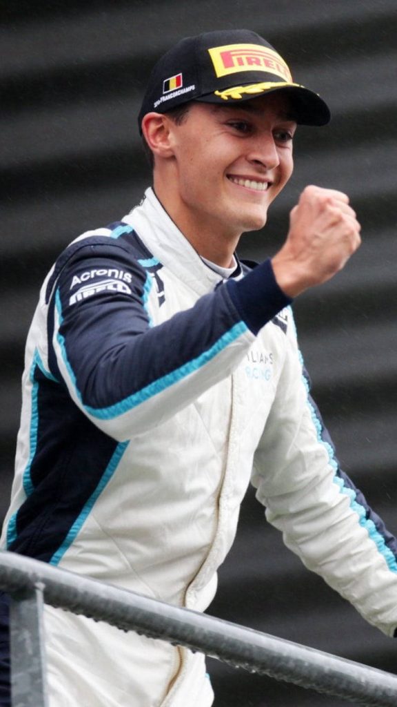 George Russell Williams Racing celebrating F1 win with fist pump and Pirelli Spa Francorchamps cap Wallpaper