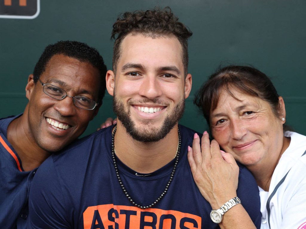 George Springer Houston Astros with parents smiling green background family support wallpaper