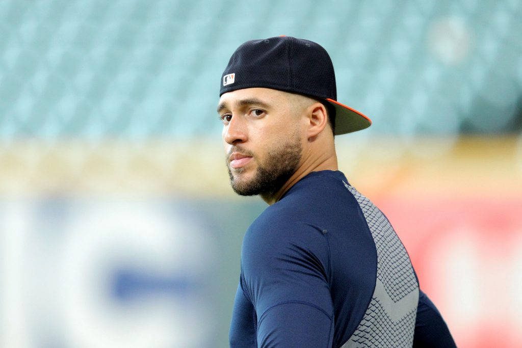 George Springer focused look in navy shirt backward cap blurred stadium baseball wallpaper