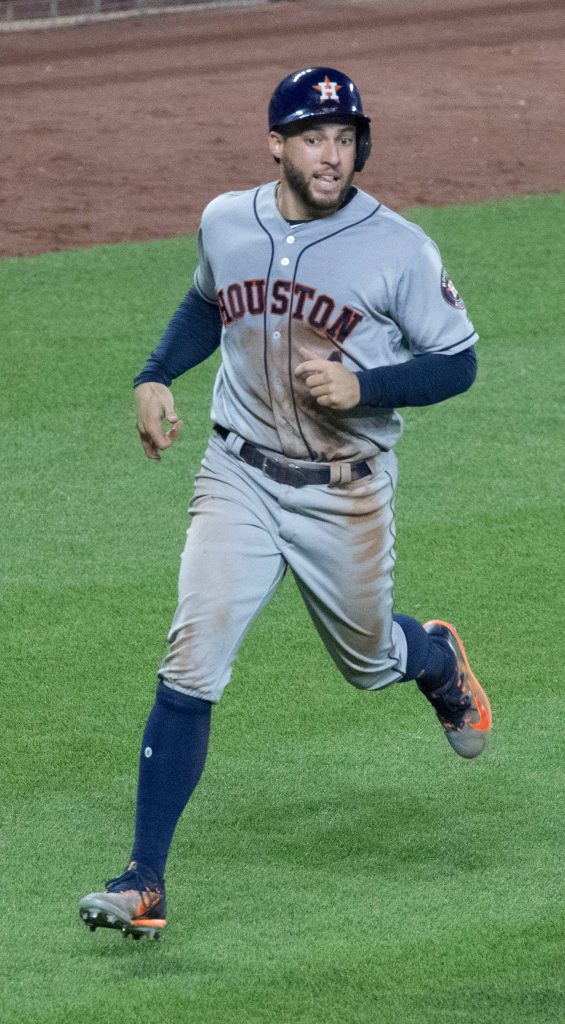George Springer in grey Houston Astros uniform running bases mid-stride vibrant baseball action Wallpaper