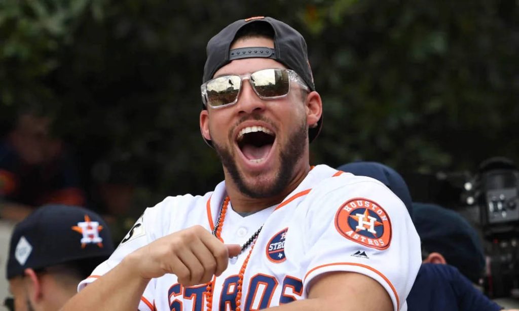 MLB star George Springer in white Astros jersey sunglasses and cap vibrant baseball fan wallpaper