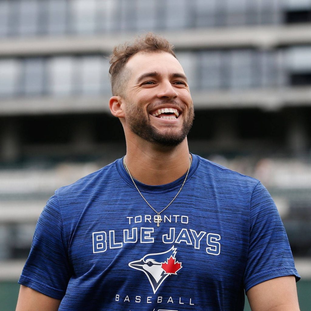 Toronto Blue Jays outfielder George Springer smiling in team shirt with stadium background wallpaper