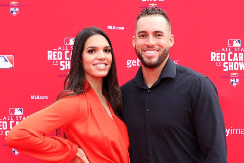 MLB star George Springer and wife Charlise Castro smiling on MLB All-Star Red Carpet event wallpaper