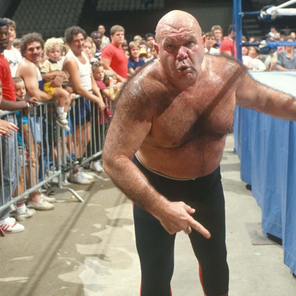 Wrestling legend George The Animal Steele pointing at fans ringside vintage wrestling wallpaper