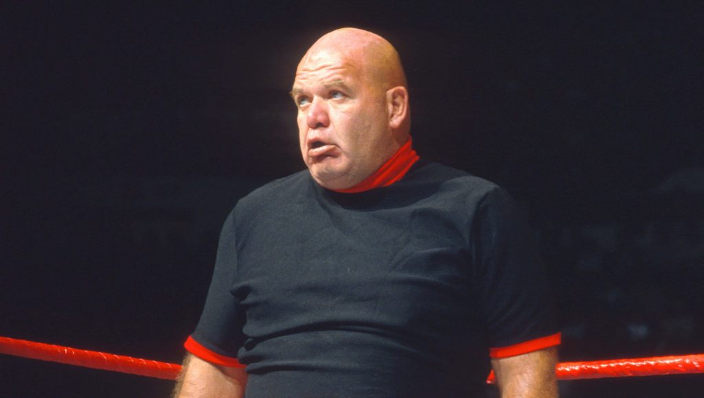 George The Animal Steele wrestling legend intense gaze black attire red ropes wallpaper background