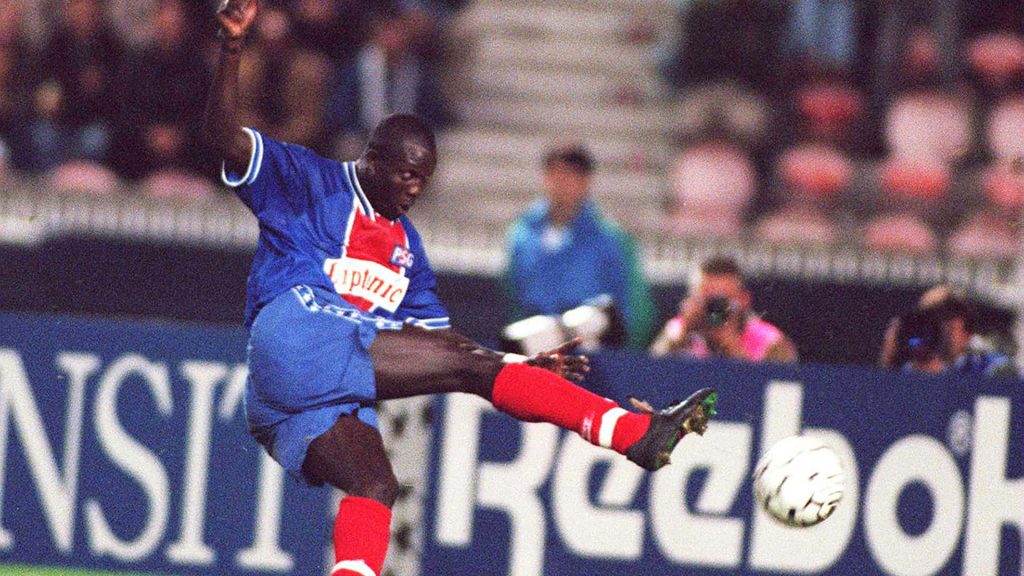 George Weah mid-air strike PSG kit dynamic football action wallpaper background energy