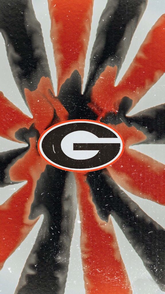 Georgia Bulldogs phone wallpaper with red black G logo and vibrant tie-dye sun rays background
