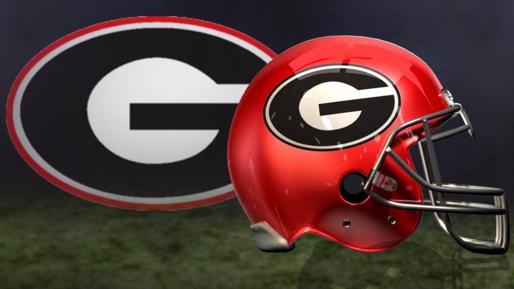 Georgia Bulldogs red football helmet with iconic G logo on dark moody background wallpaper