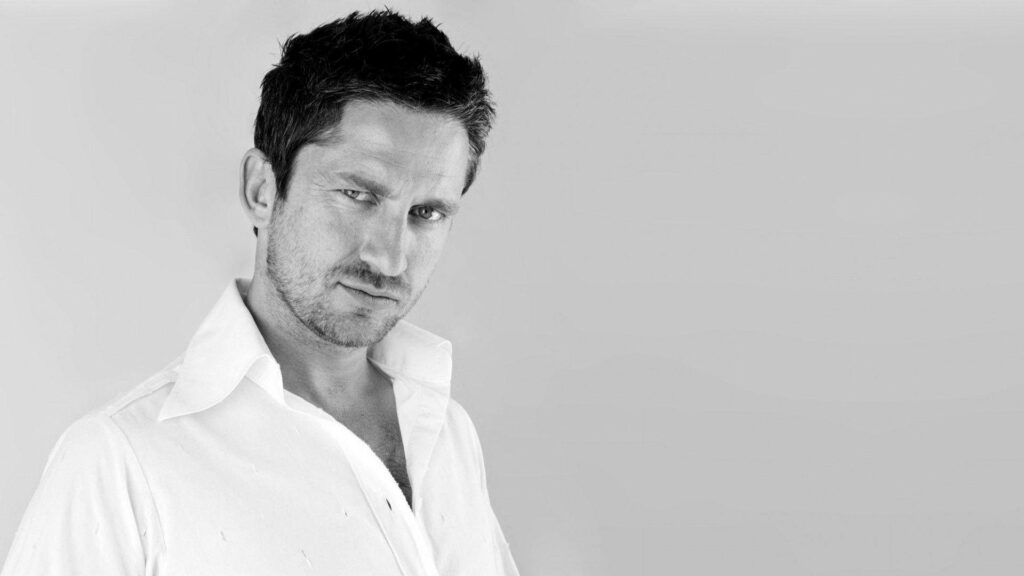 Gerard Butler black and white side profile wallpaper showcasing stylish intense confident charisma