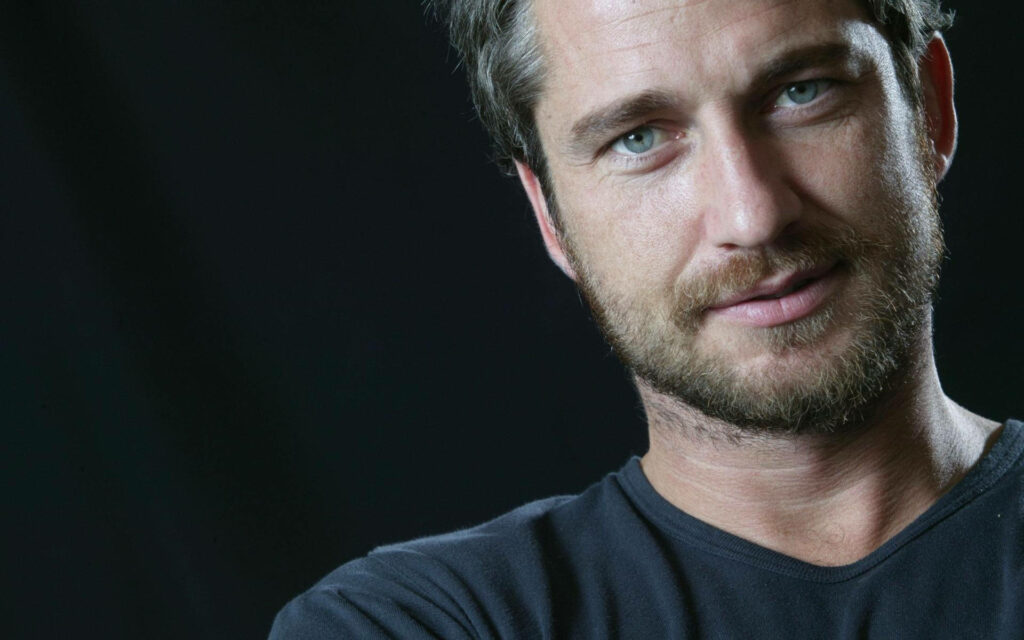 Gerard Butler close-up portrait showing rugged charm and charisma celebrity wallpaper background