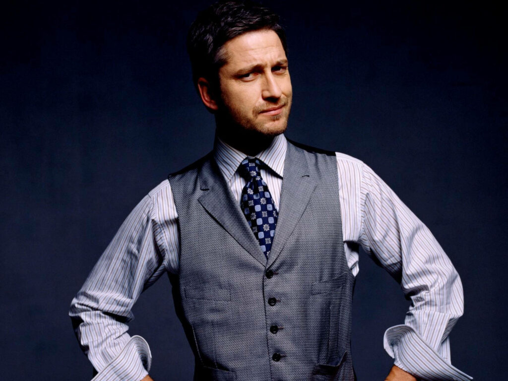 Gerard Butler confident in sharp formal vest and tie dark background wallpaper image
