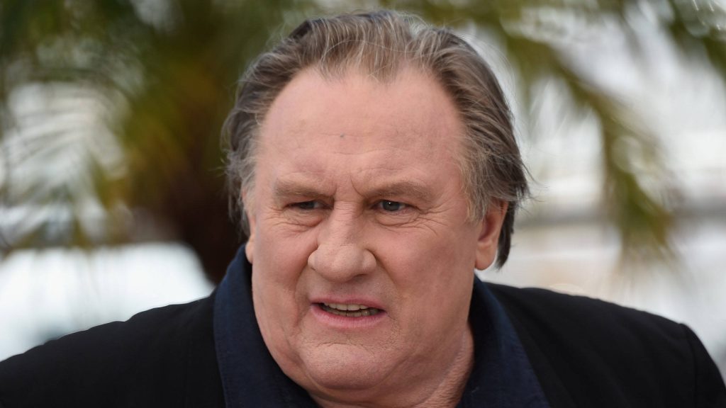 Gérard Depardieu candid portrait with confused expression outdoor natural light wallpaper background