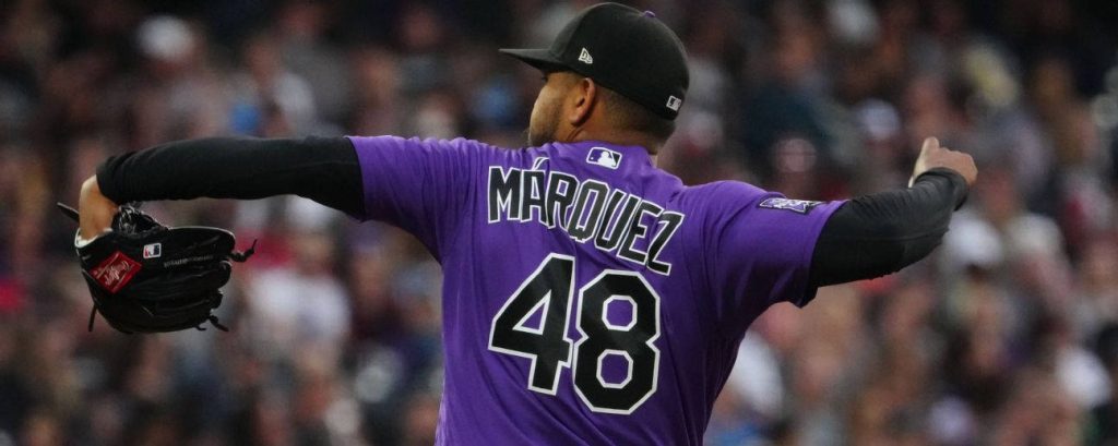 Colorado Rockies pitcher Germán Márquez in purple jersey number 48 pitching in stadium action Wallpaper